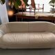 Rounded off-white leather sofa