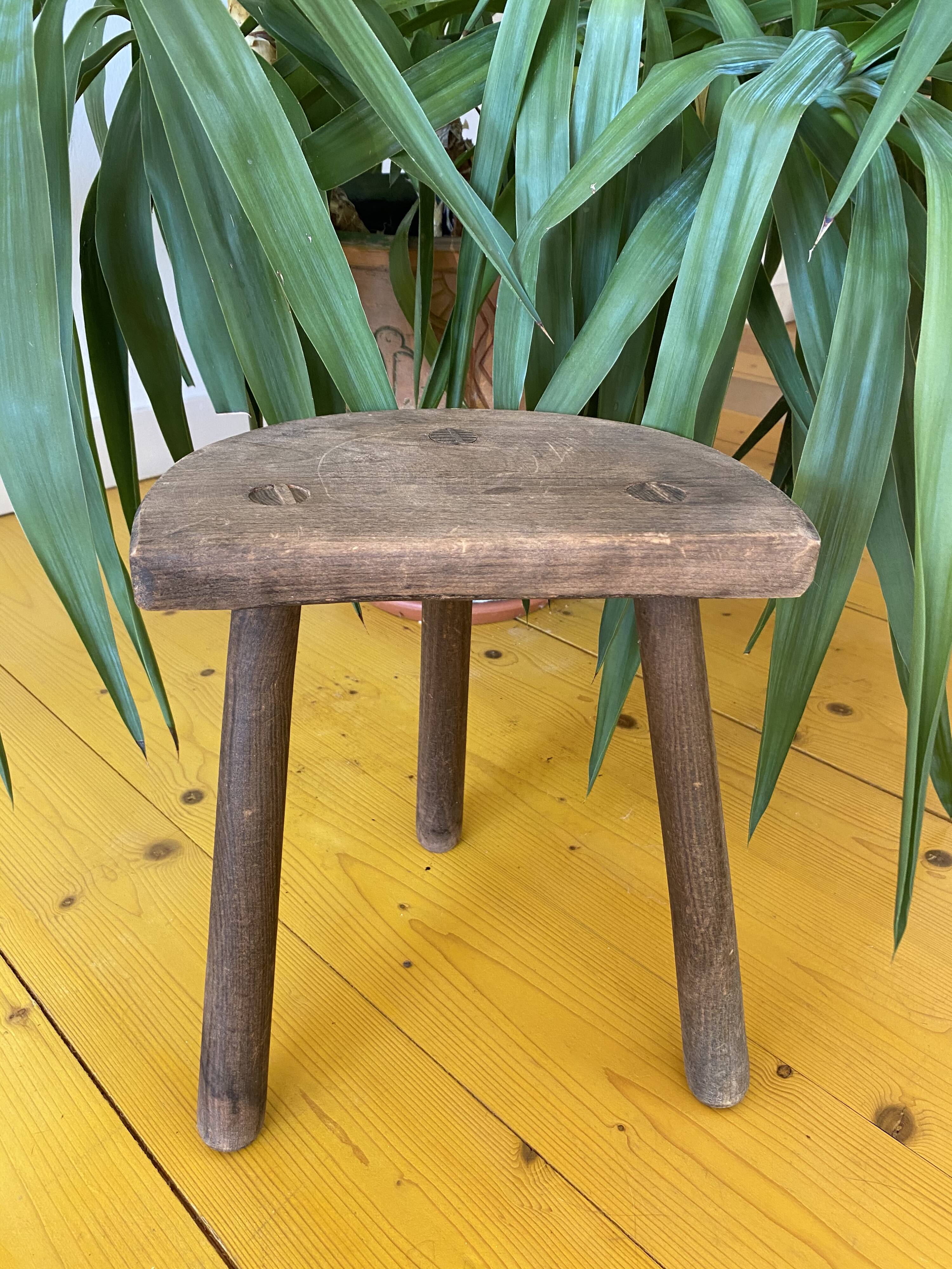 Old wooden tripod stool