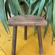 Old wooden tripod stool