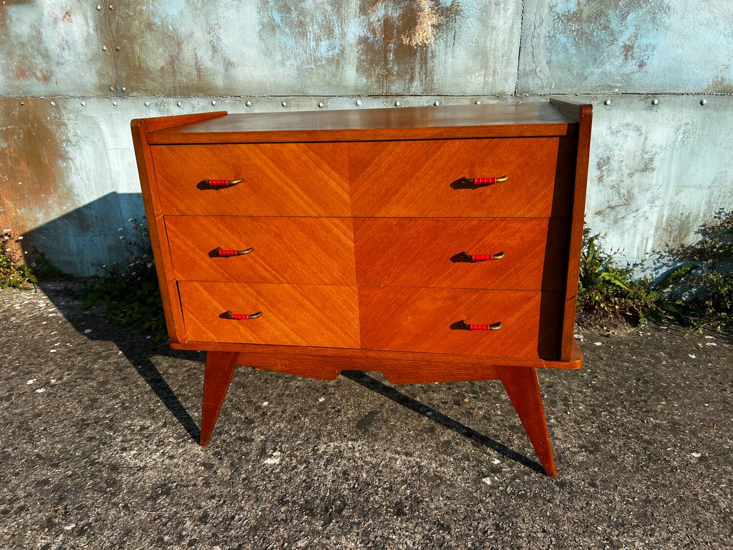 Vintage chest of drawers with compass feet.