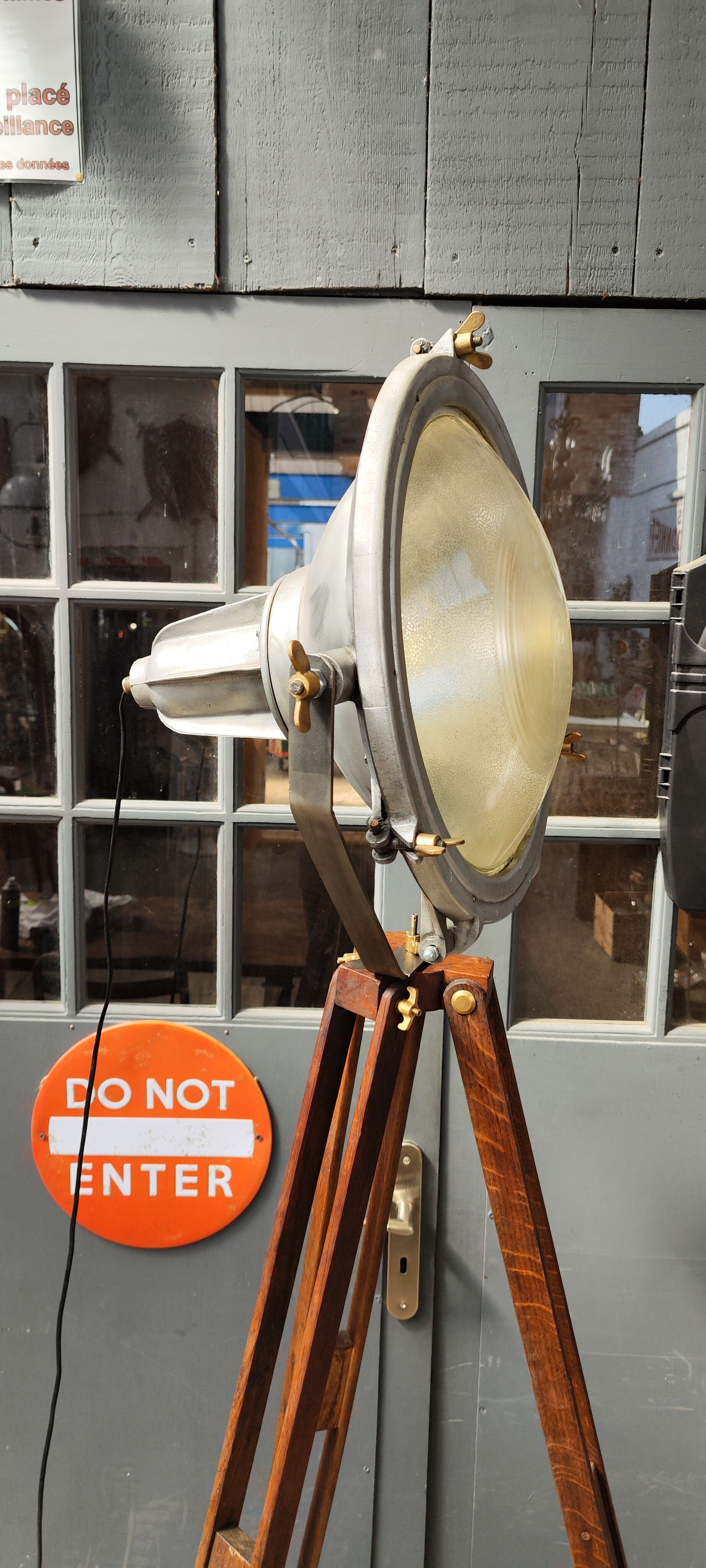 Industrial projector on tripod waxed wood