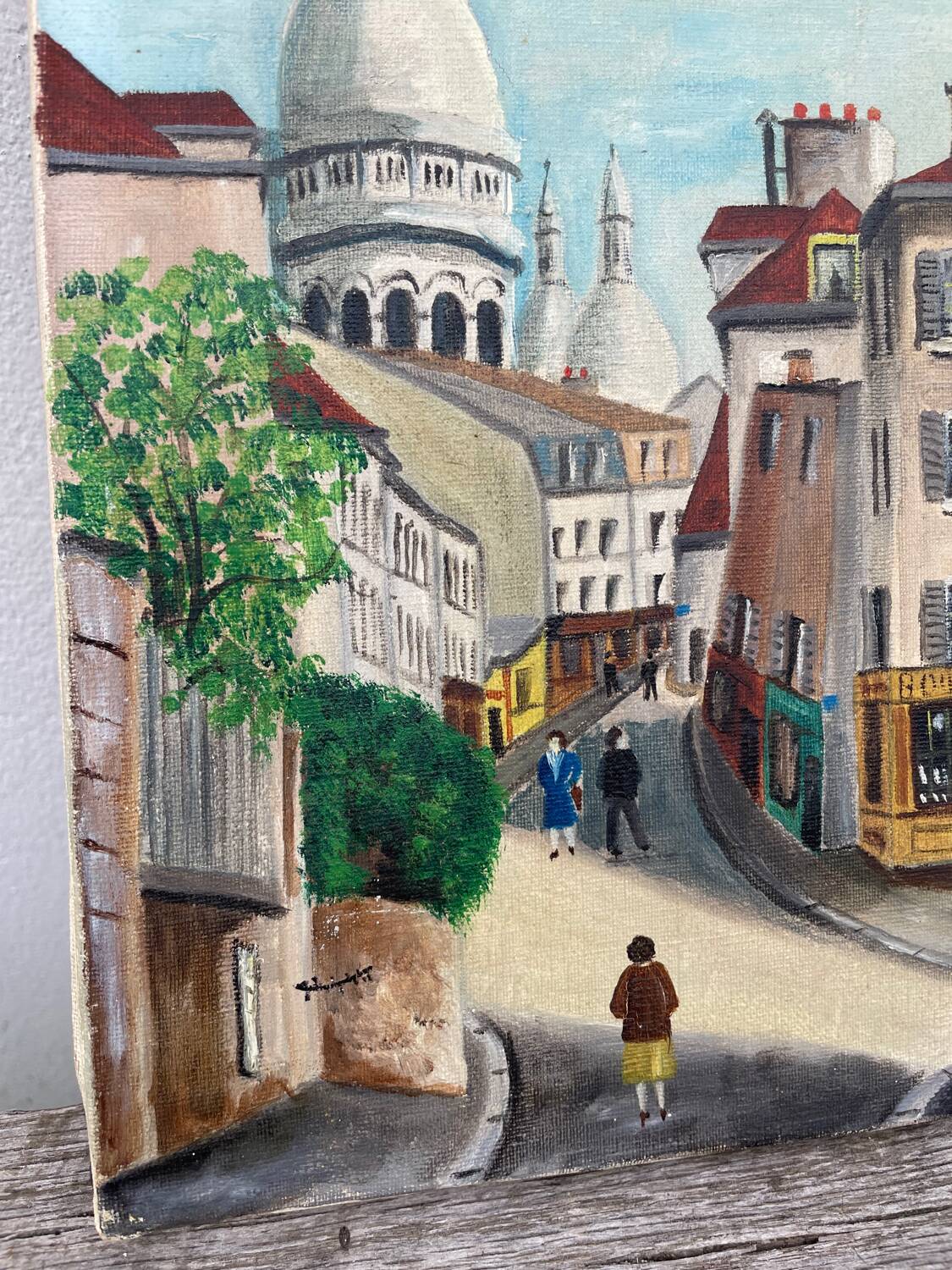 Old oil painting depicting a street in Montmartre