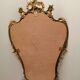 Wall mirror with gold patina ornaments