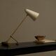 Mid Century adjustable table lamp with perforated shade from the 1950s.