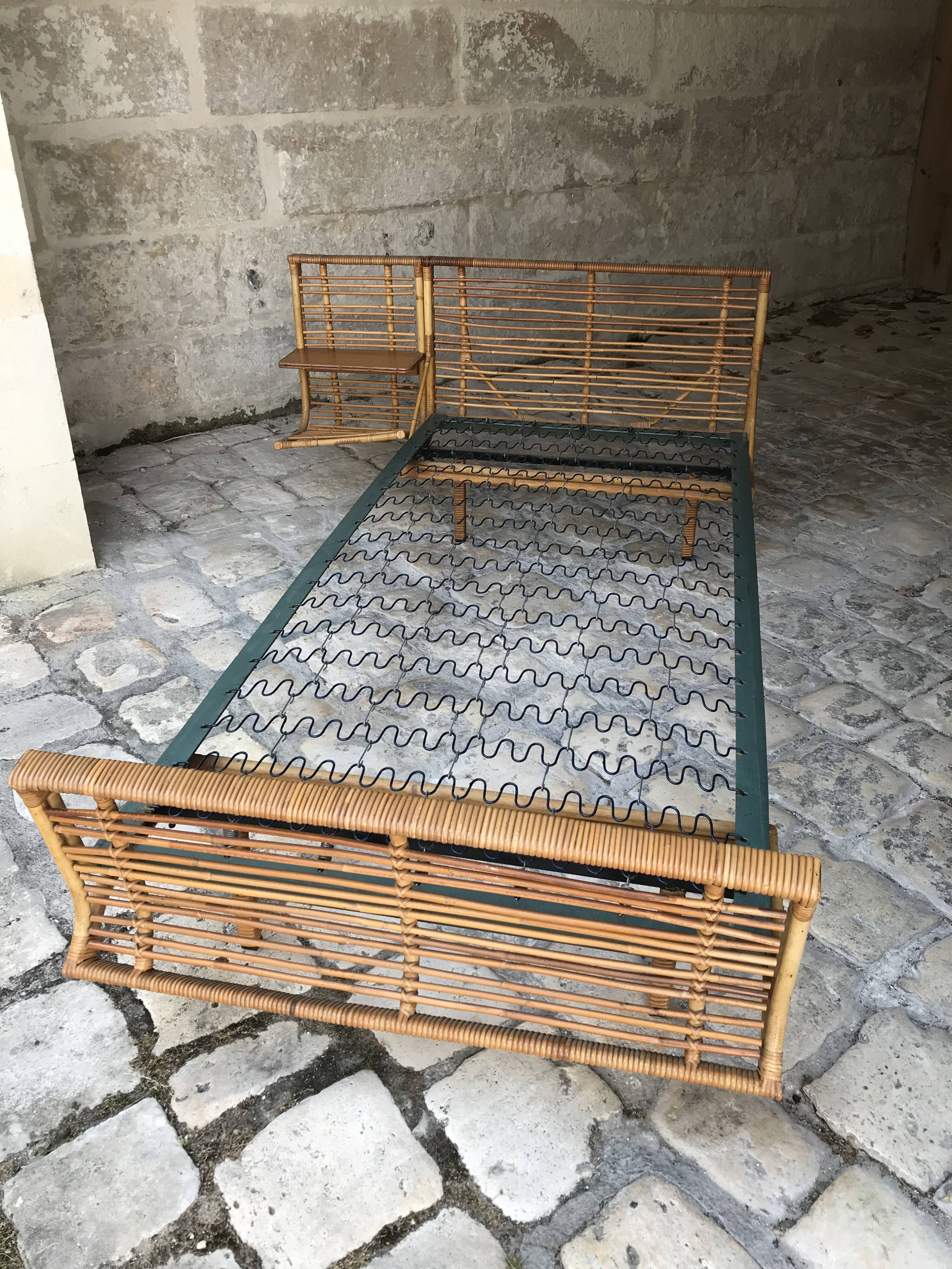 Twin rattan beds with built-in bedside tables