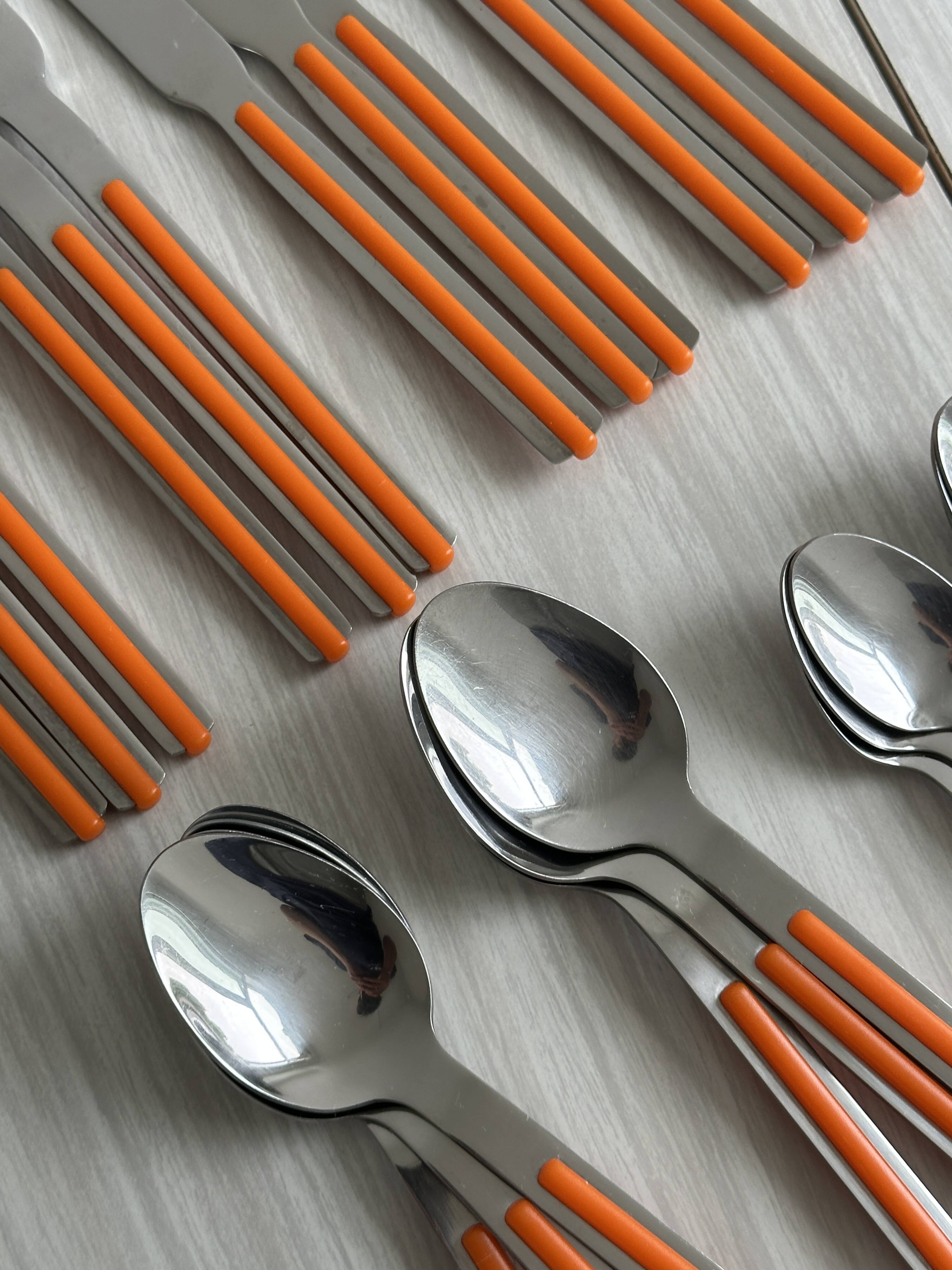 24 vintage stainless steel and orange plastic cutlery sets