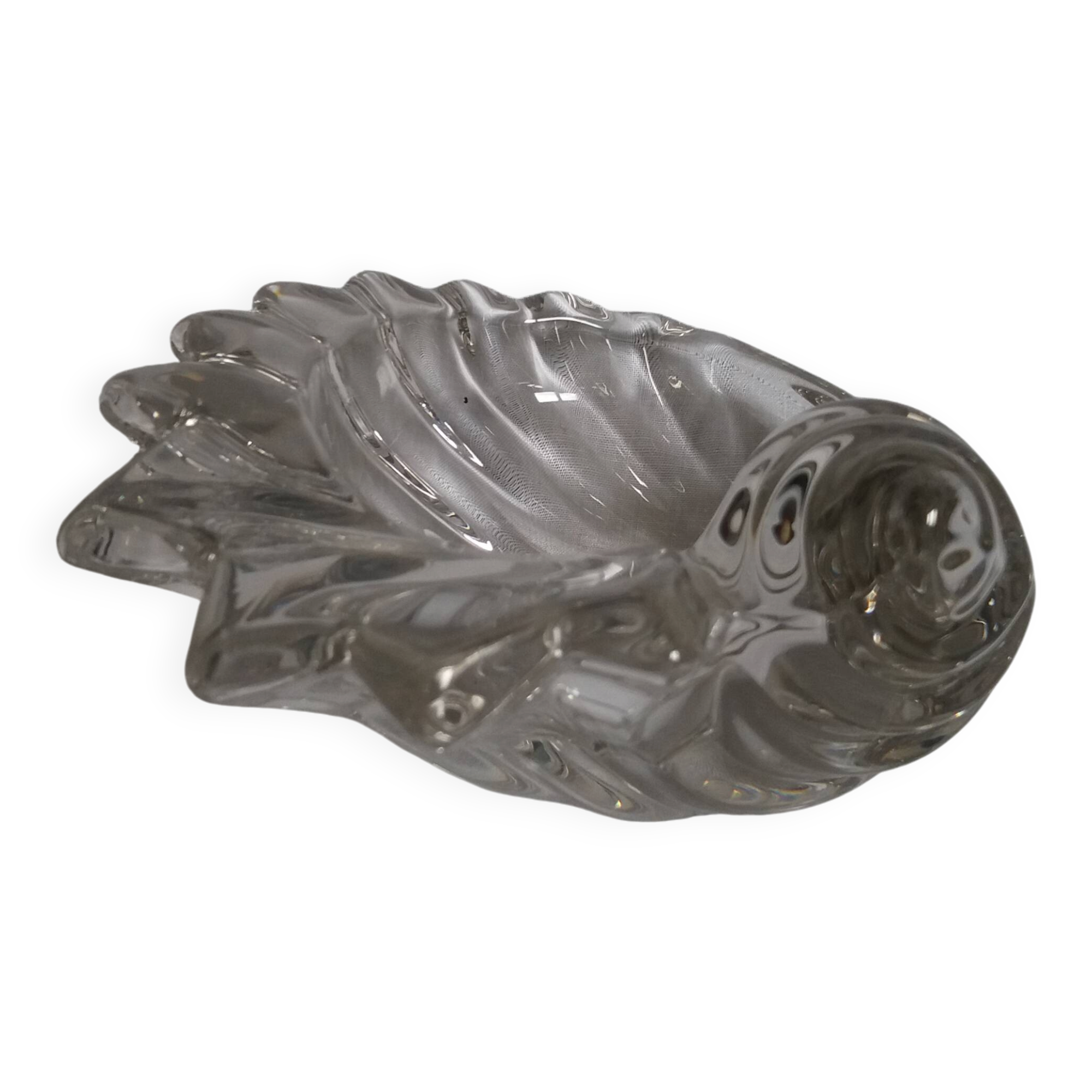 Shell-shaped crystal paperweight.