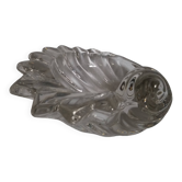 Shell-shaped crystal paperweight.