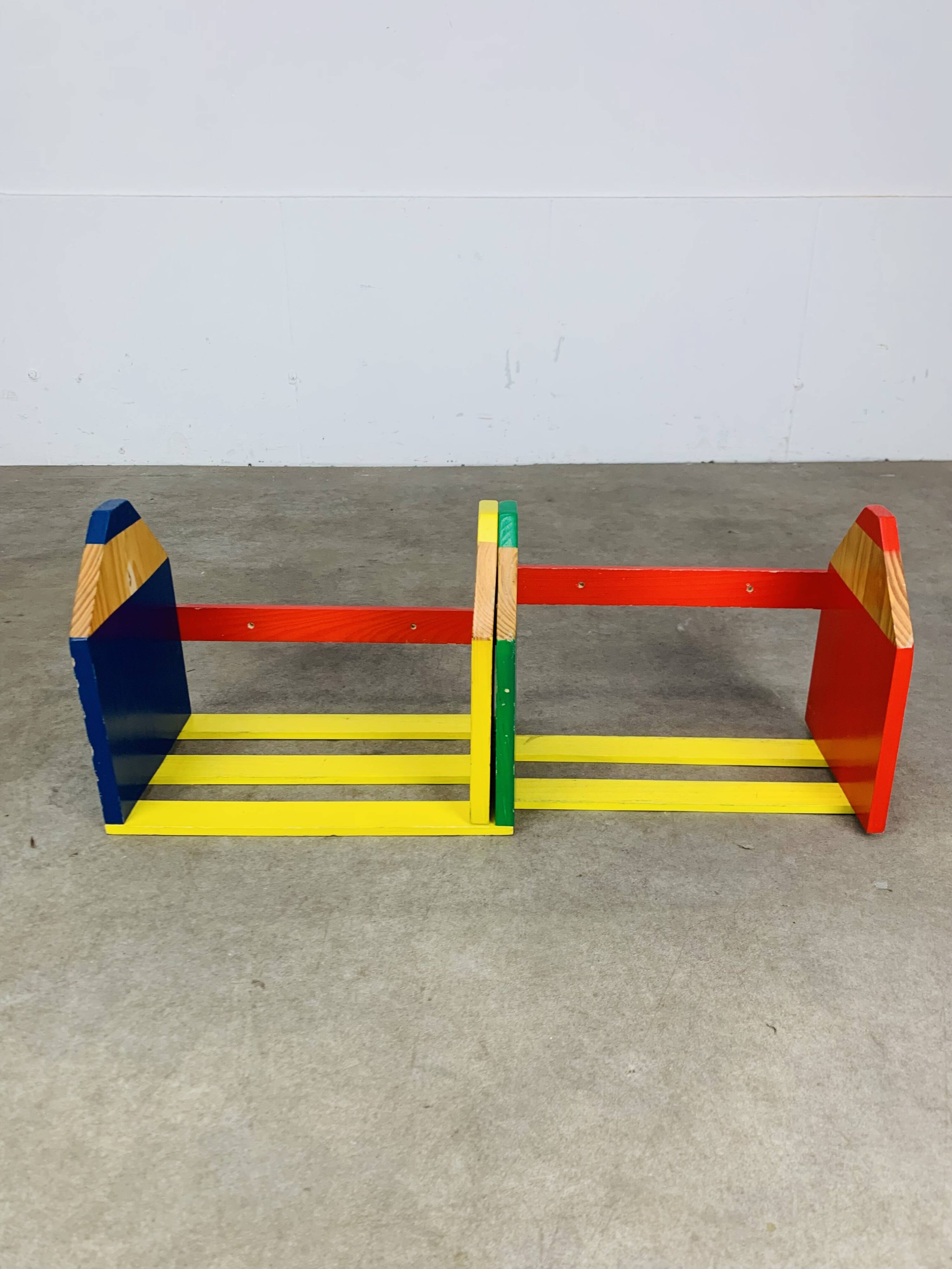 Modular wall-mounted pencil shelf in Pierre Sala style, for children.