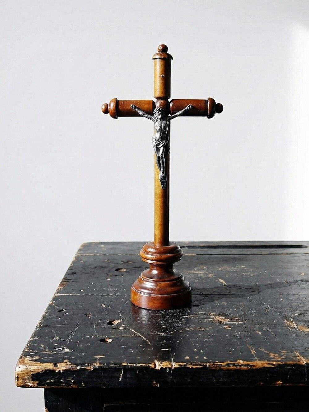 Antique wooden altar crucifix with a turned design and silver-plated Christ.
