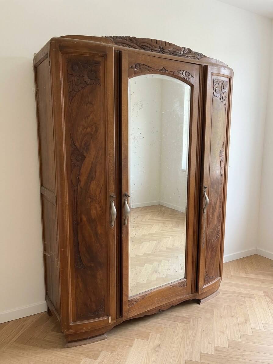 Antique carved wooden wardrobe with mirror