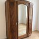 Antique carved wooden wardrobe with mirror