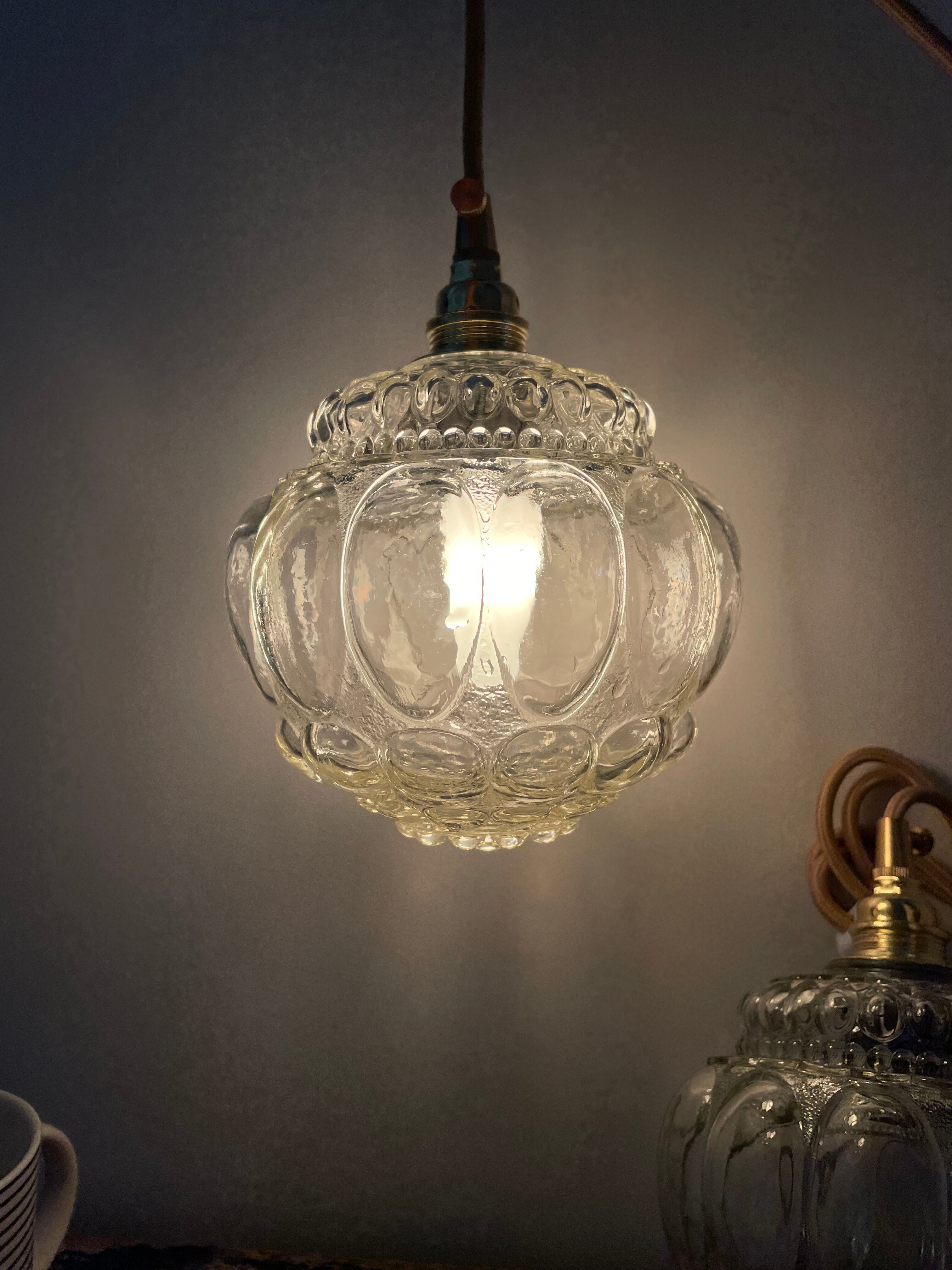 Set of two vintage globe players in chiseled glass