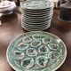 Set of 12 plates and an oyster dish or other in majolica.