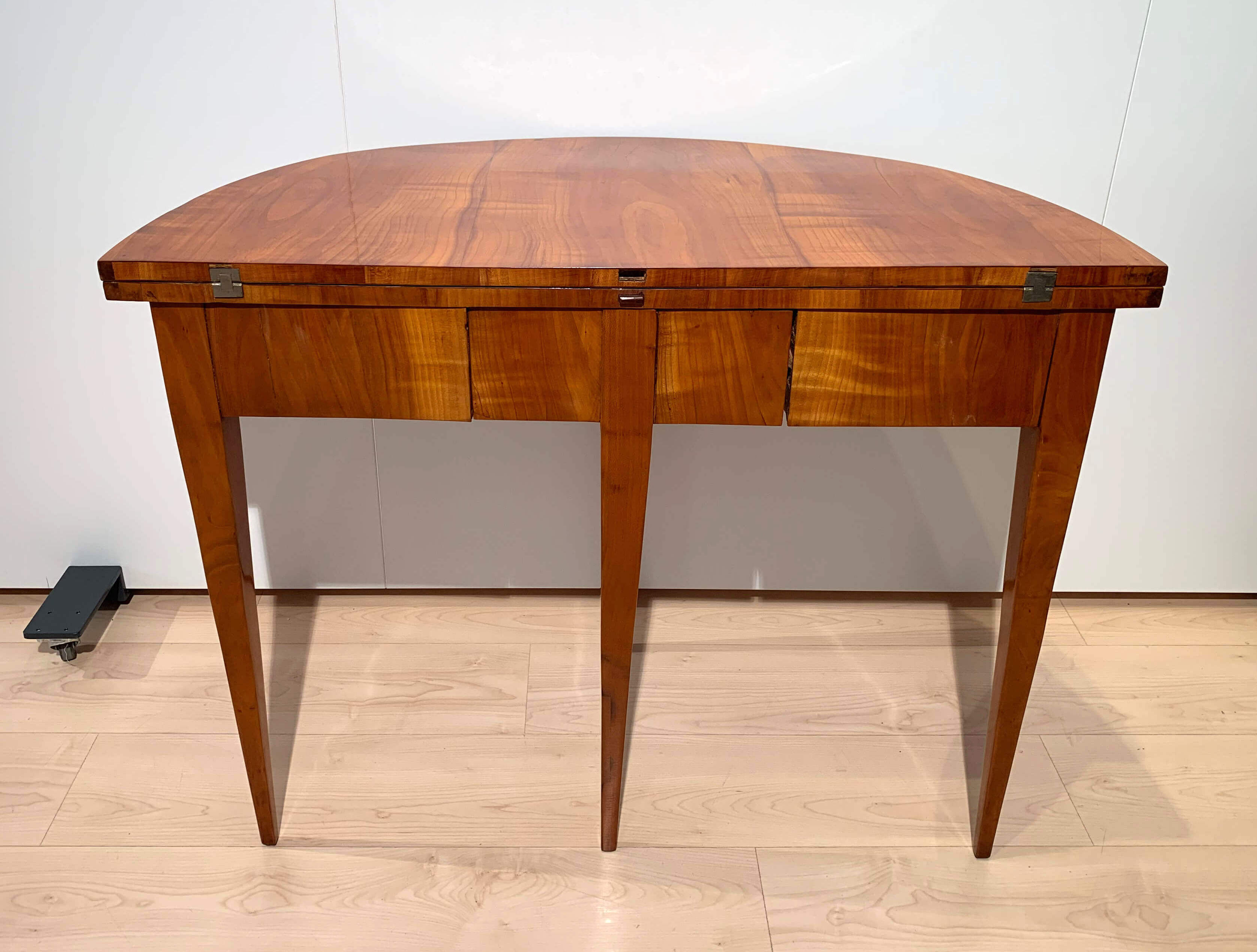 Biedermeier demi-lune fold-out table, cherry veneer, south germany, circa 1820