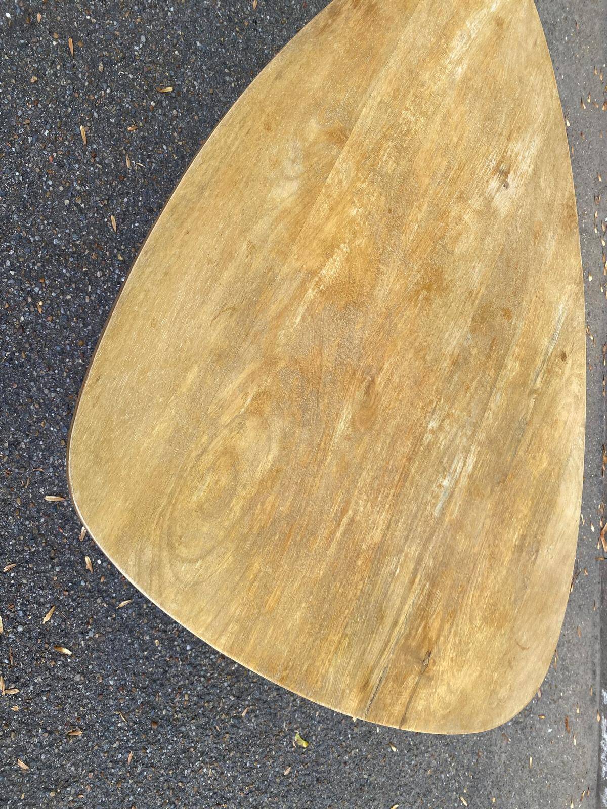 Scandinavian coffee table in the shape of a pebble/bean made of light solid wood from the years.