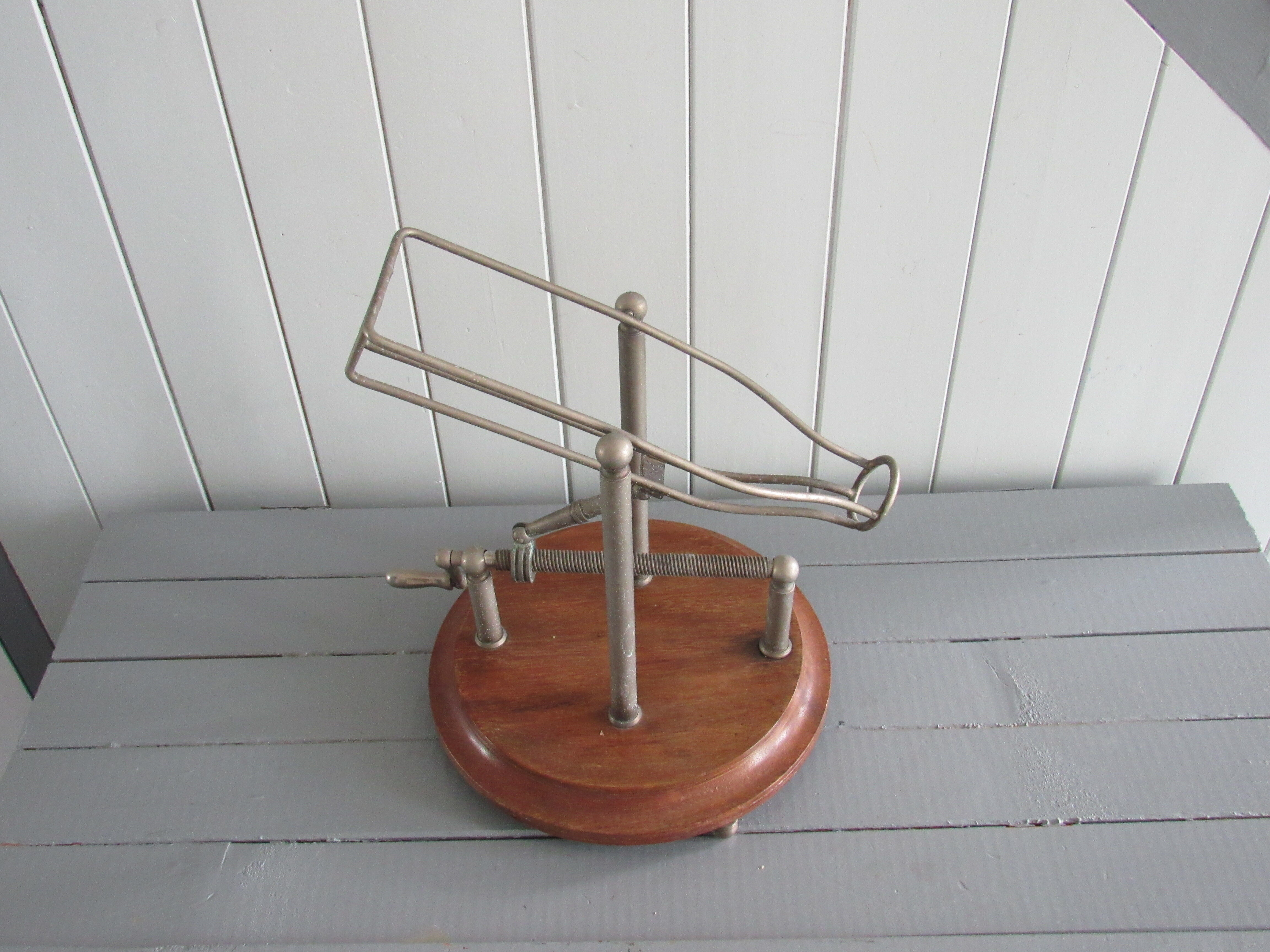 Old mechanical wine decanter on wooden base