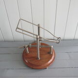 Old mechanical wine decanter on wooden base