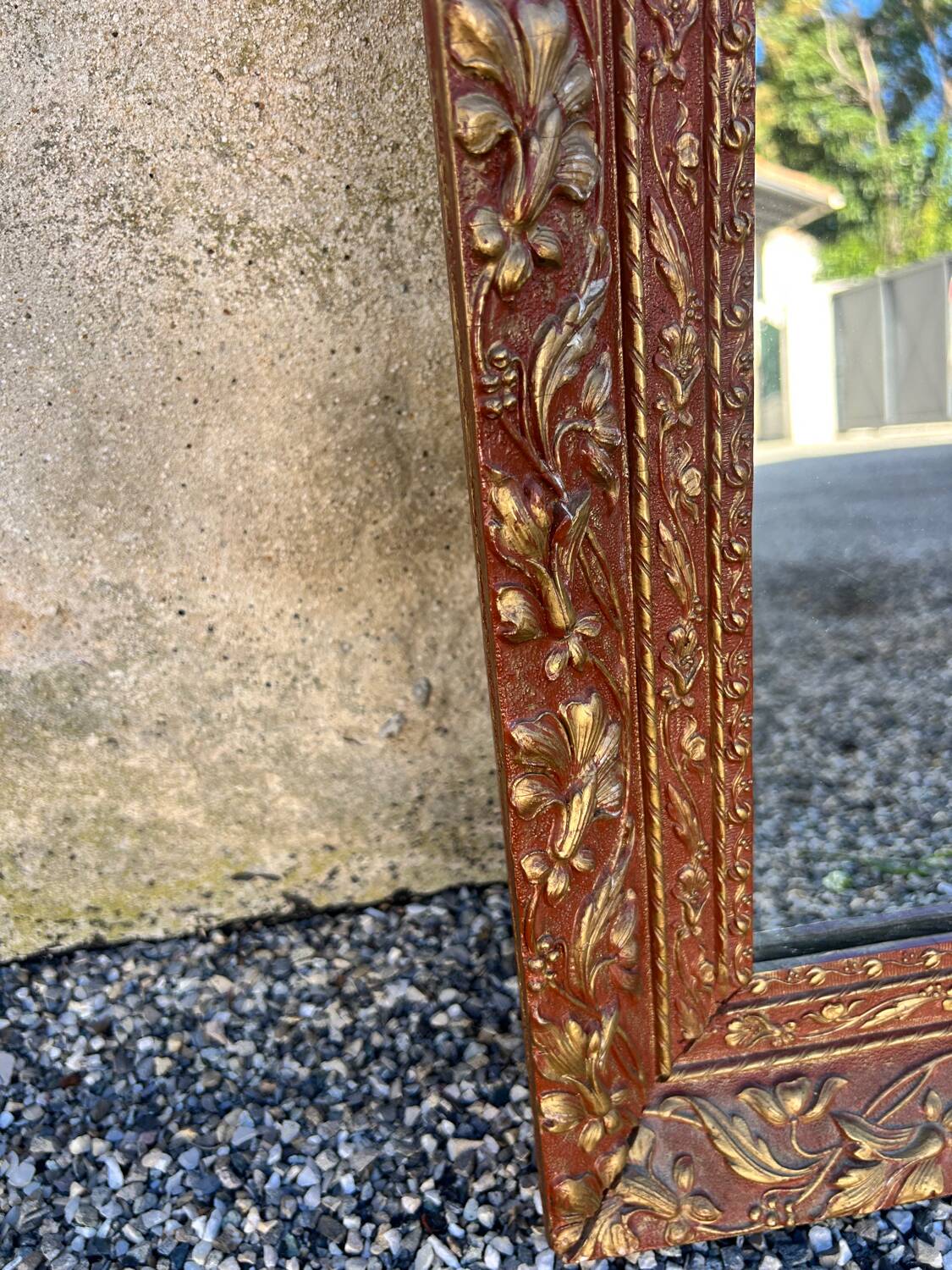 Antique mirror in patinated gilt wood