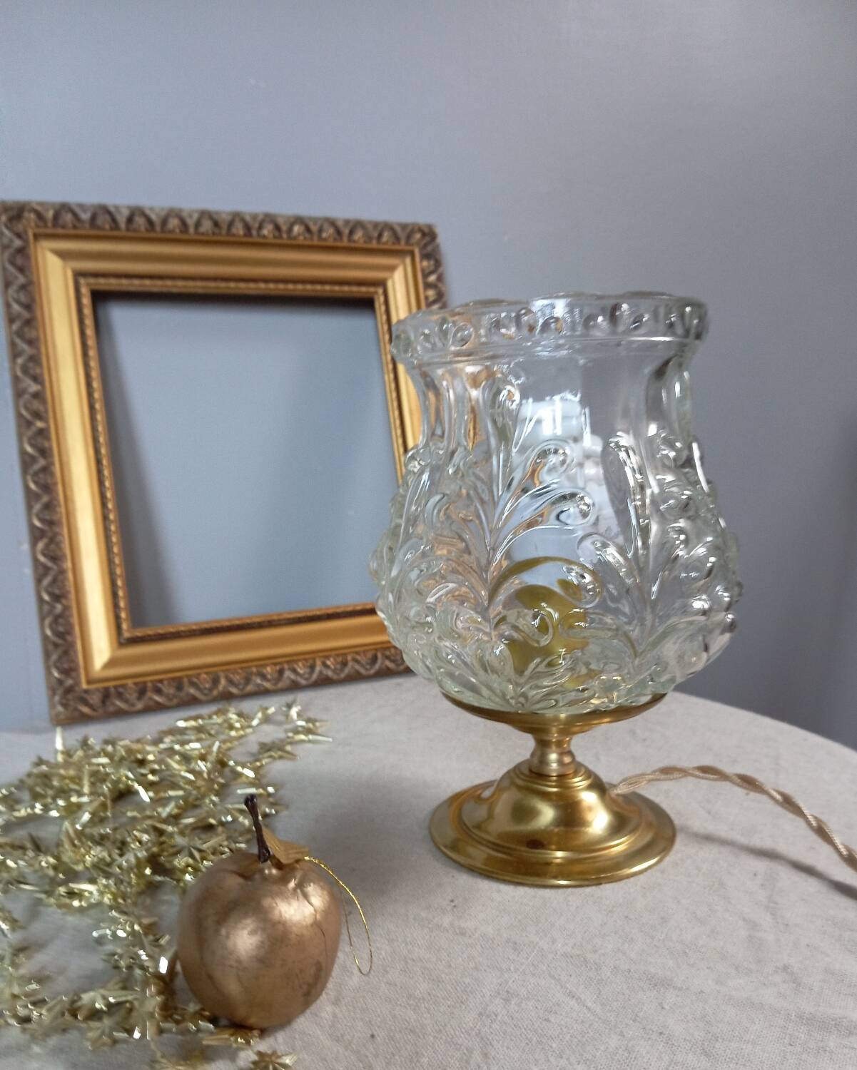 Brass foot table lamp, transparent textured molded globe, art deco style