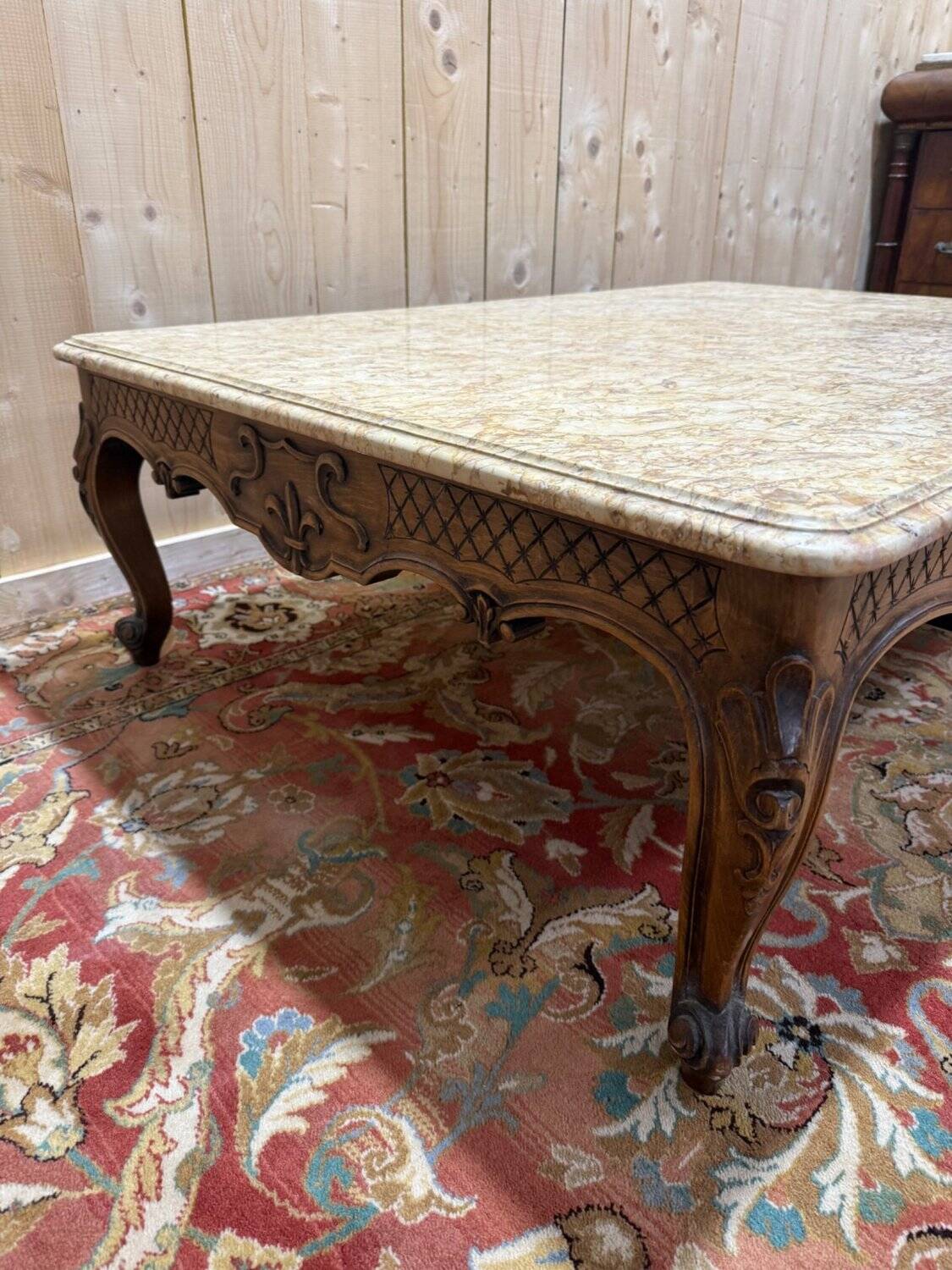 Louis XV style coffee table in walnut with a marble top.