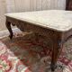 Louis XV style coffee table in walnut with a marble top.