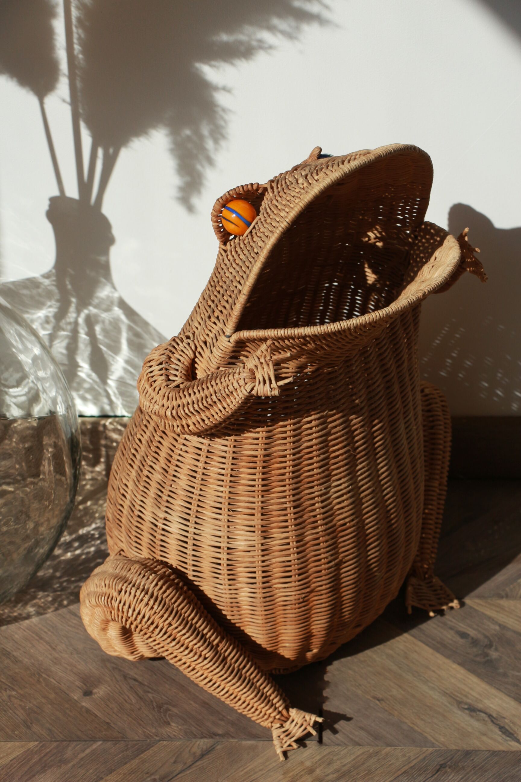 Wicker frog magazine rack by Olivier Cajan