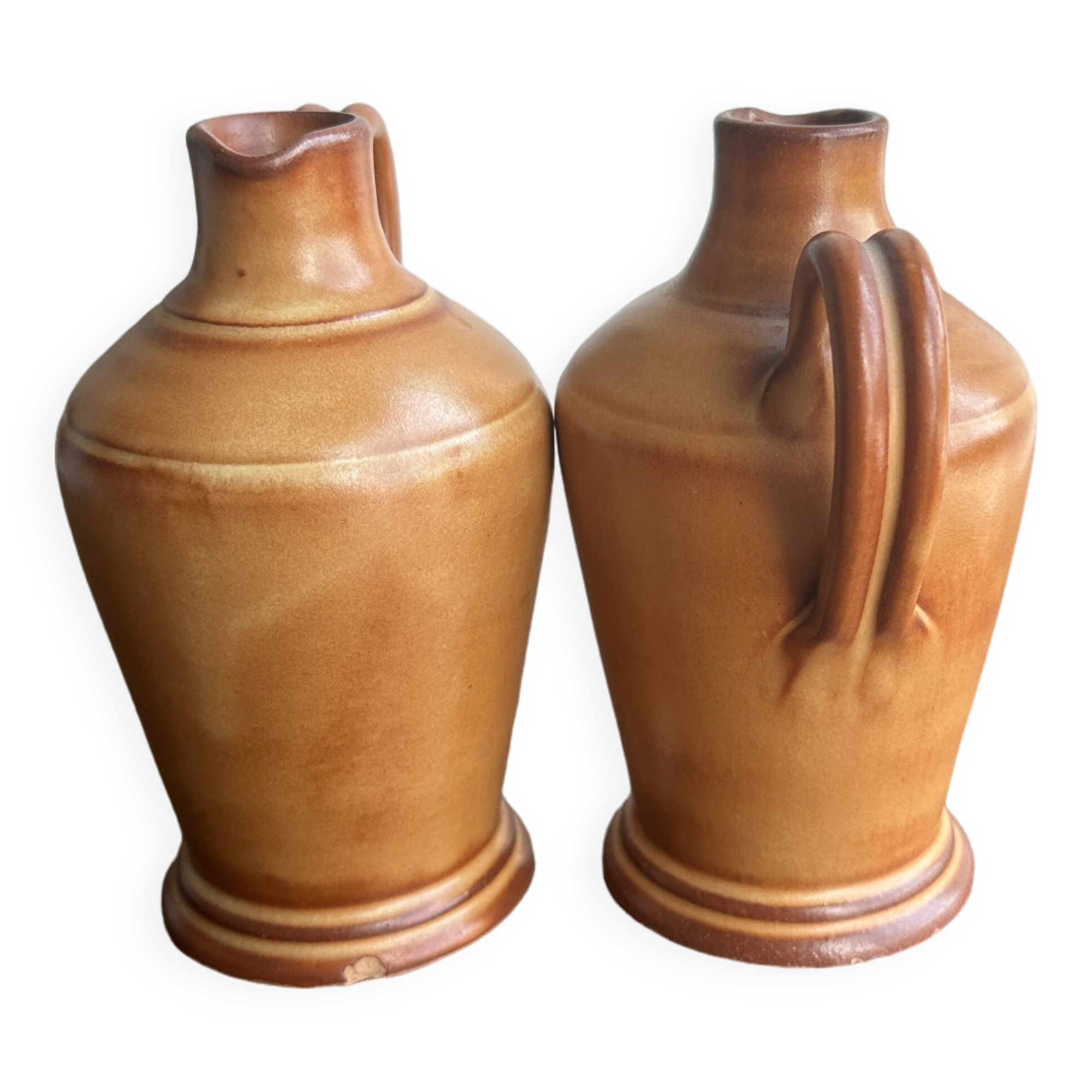 Pair of mini orange stoneware pitchers