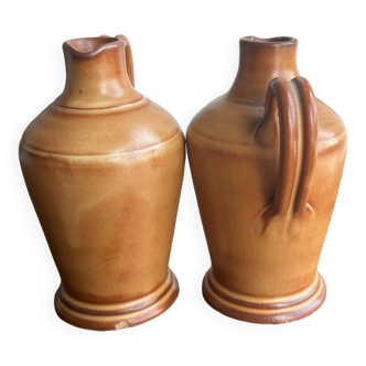 Pair of mini orange stoneware pitchers