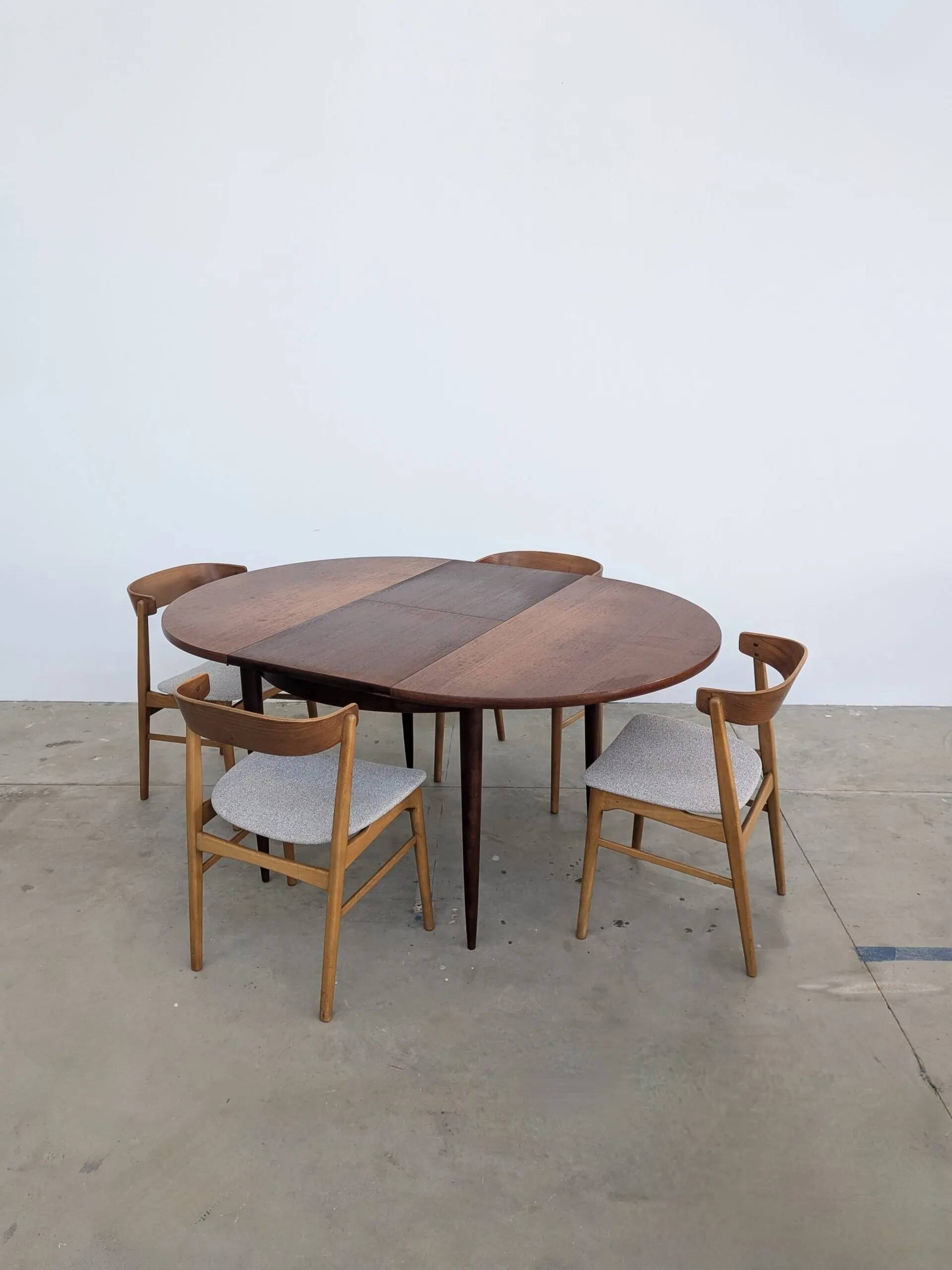 Round extendable wooden dining table