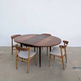 Round extendable wooden dining table