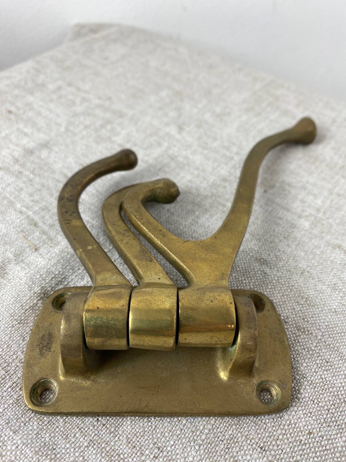 Three-pronged folding brass coat hook