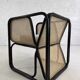 Cubic armchair in black rattan and canework
