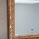 Miroir en bois stuc doré et verre biseauté