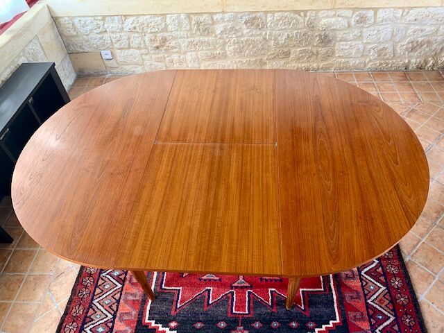 Expandable teak dining table, butterfly extension, circa 60s