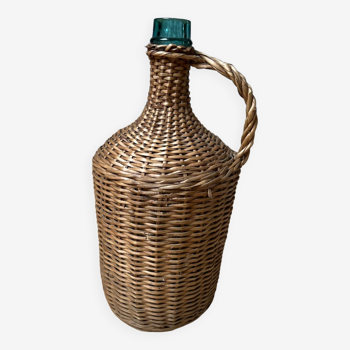 Demijohn covered in woven wicker