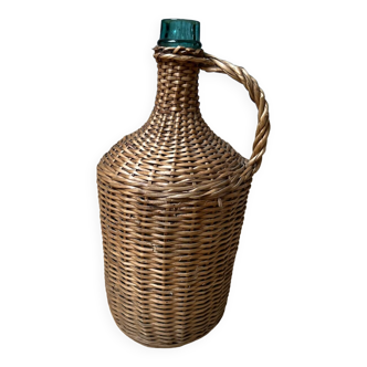 Demijohn covered in woven wicker