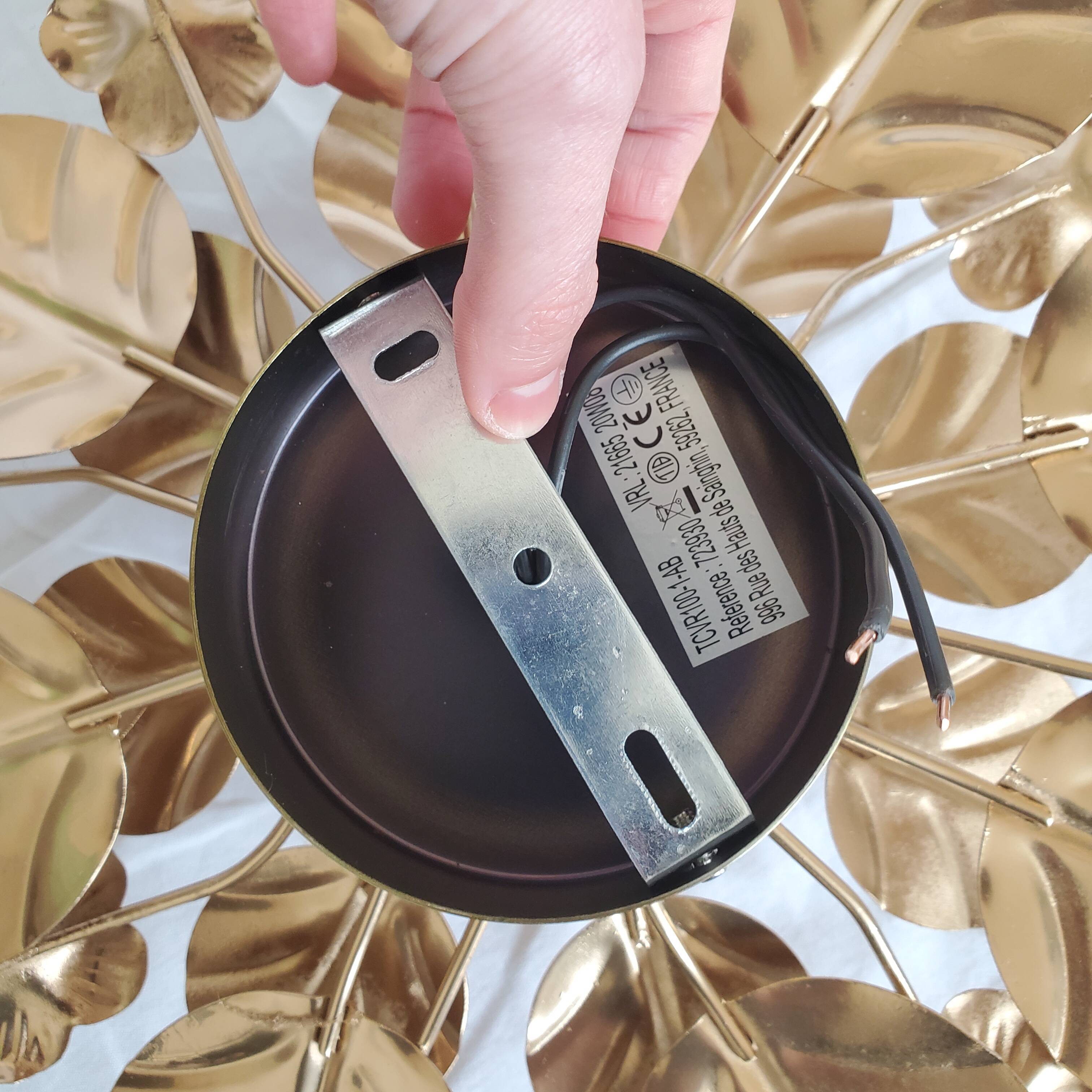 Golden metal flower sconces