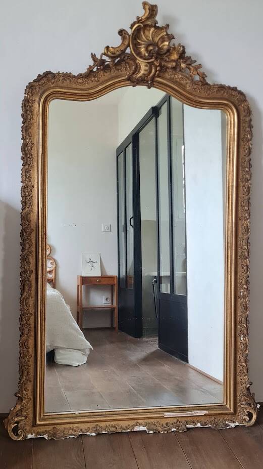 Antique Louis Philippe mirror with a pediment.