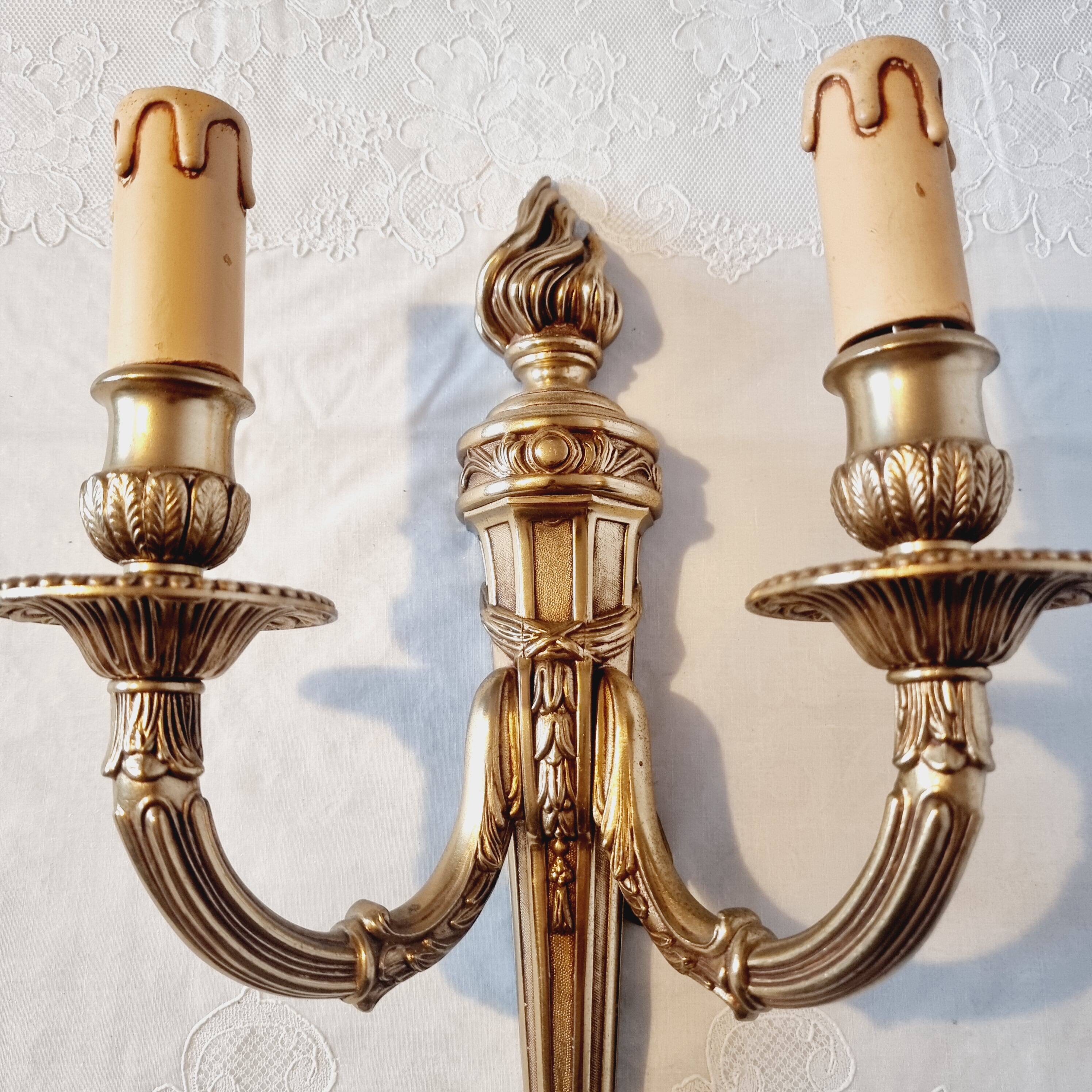 Pair of Louis XV style rocaille two-armed sconces in gilded bronze