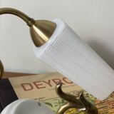 Pair of swan neck wall lights in brass, white glass and porcelain.