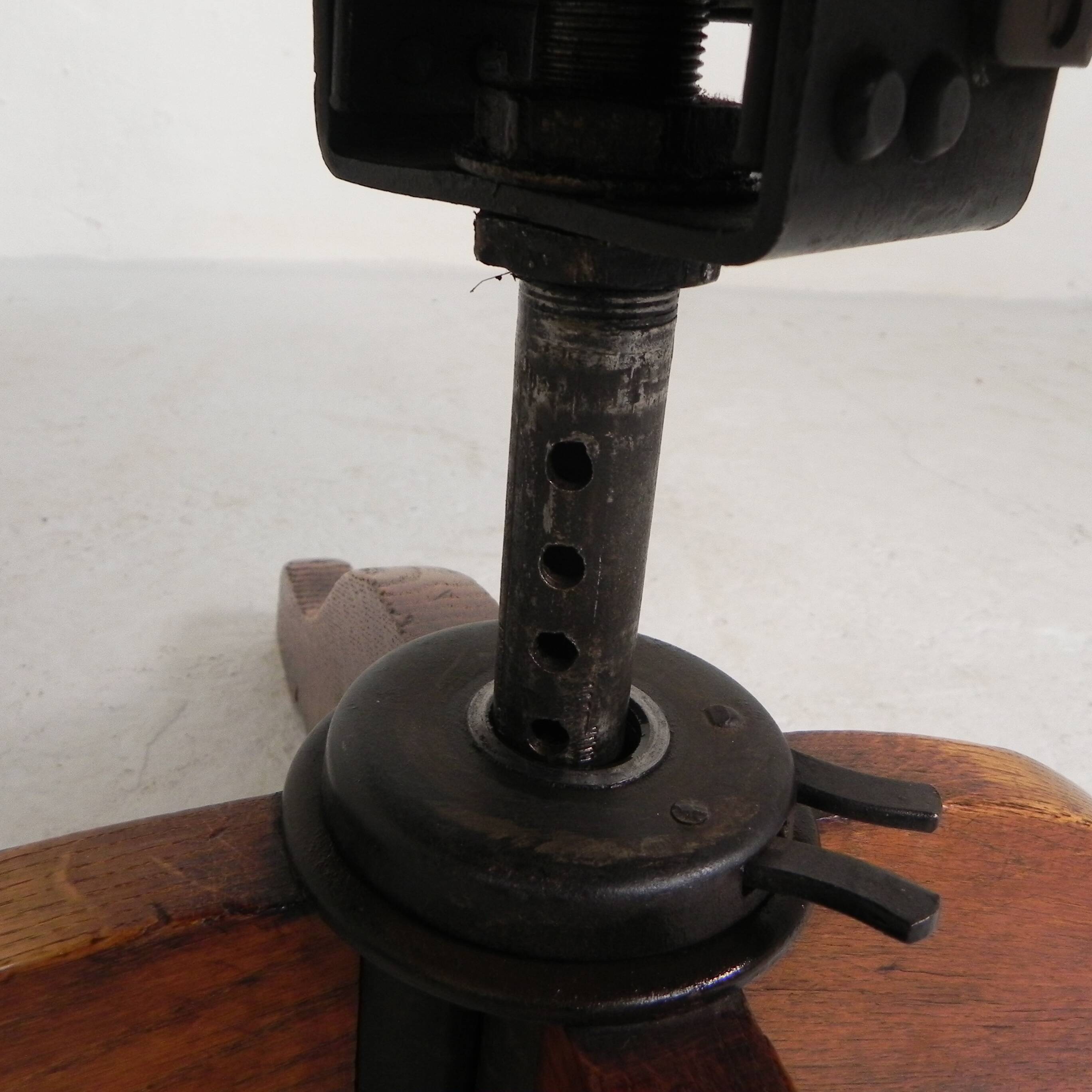 Oak office chair with a spring system and height adjustable, 1930s.