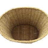 Braided straw wastepaper basket.
