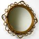 Miroir ovale en rotin et bambou espagnol, vers les années 1960.
