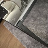 Coffee table with ceramic top and wrought iron base