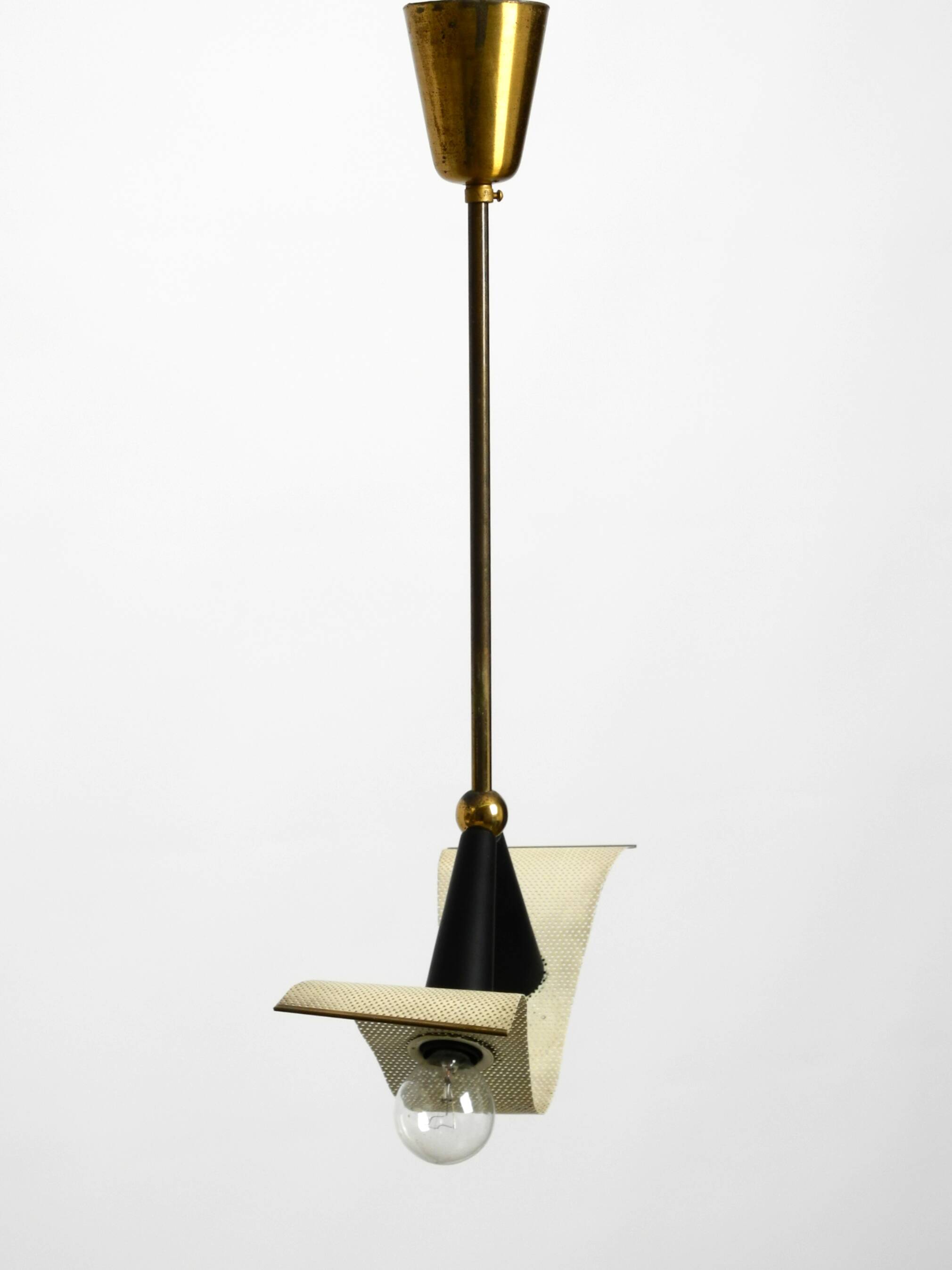 Mid Century brass ceiling lamp with a curved perforated sheet lampshade