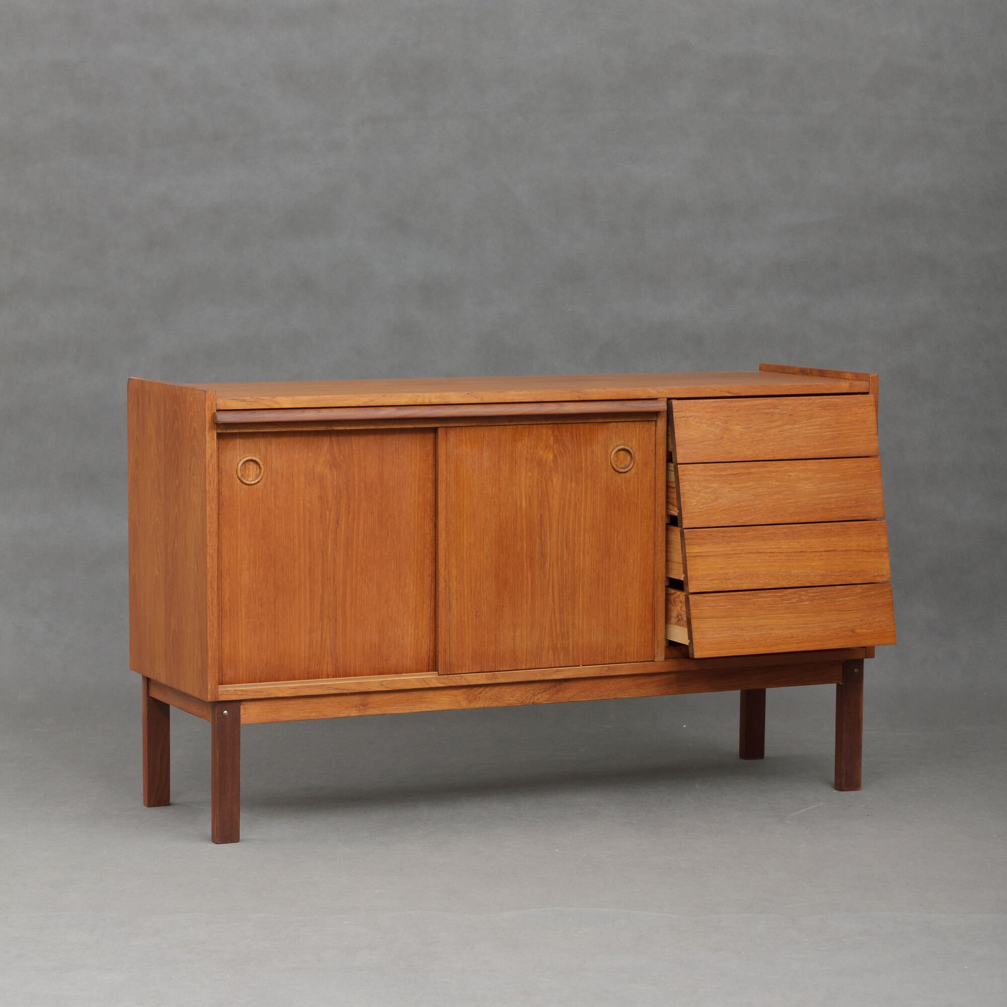 Small Danish teak sideboard with a pull out tray