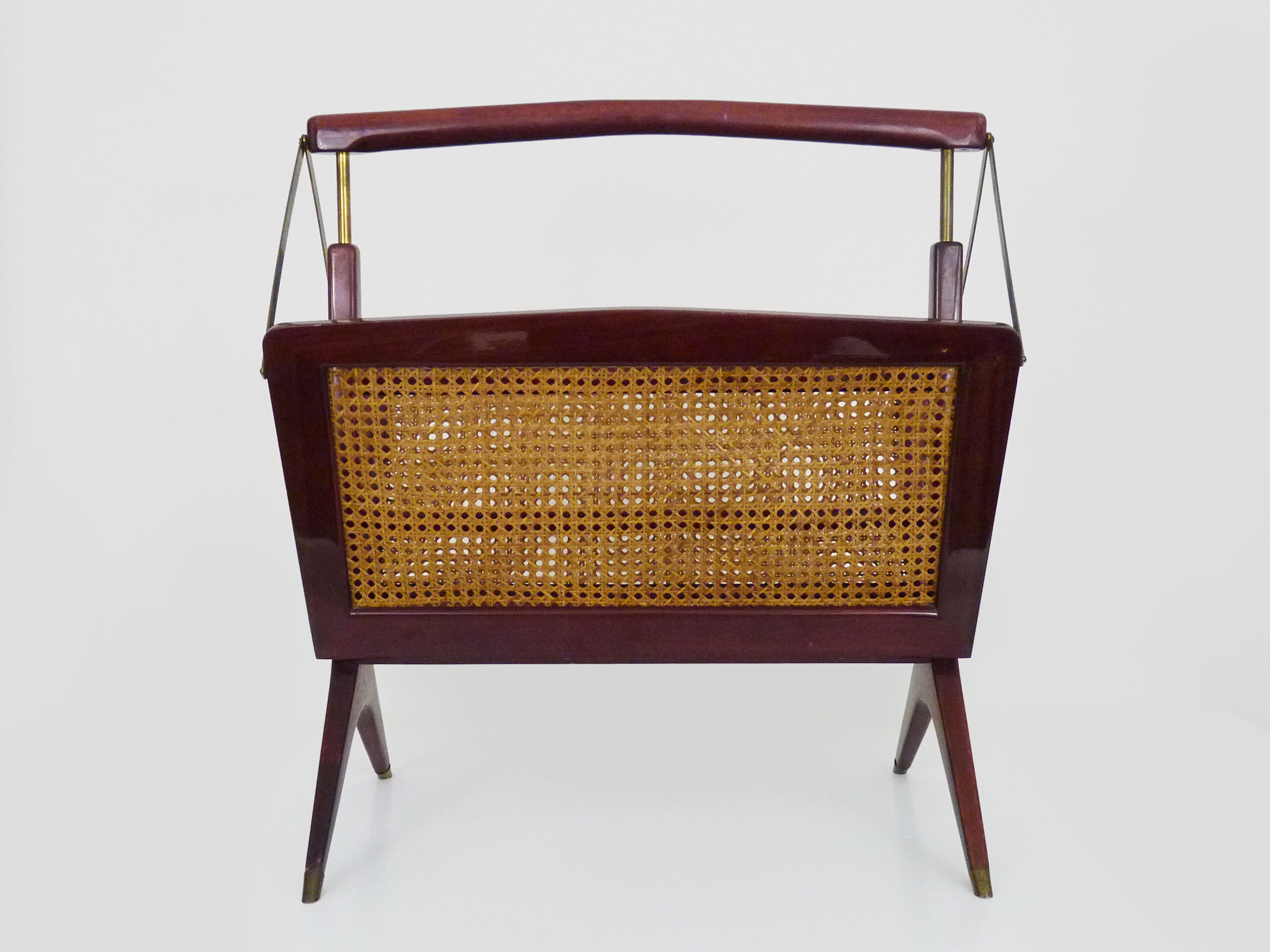 Magazine holders, italy, 1950s. walnut, canage, brass