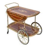 Serving table and rolling bar with drop leaves featuring floral marquetry decoration.