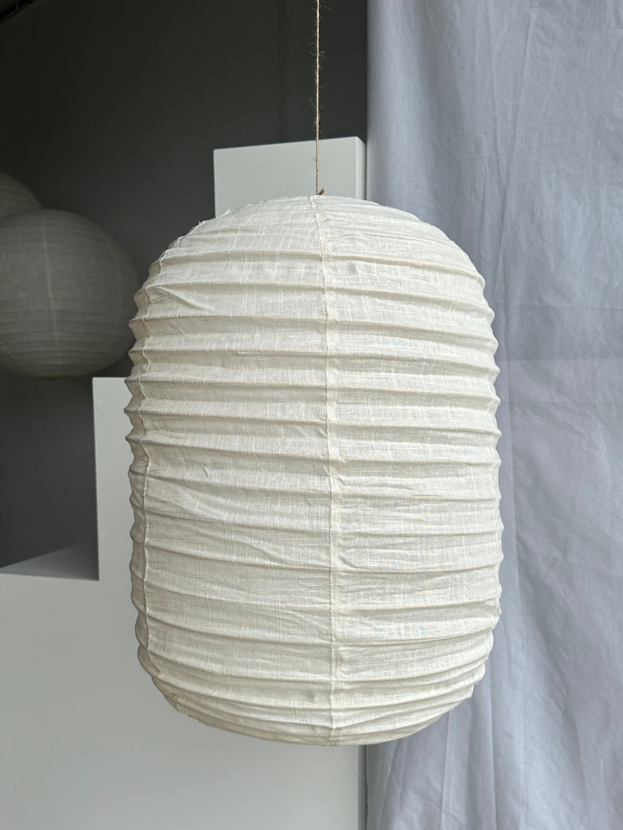Suspension in rattan and natural japanese linen lantern shape h70 d50